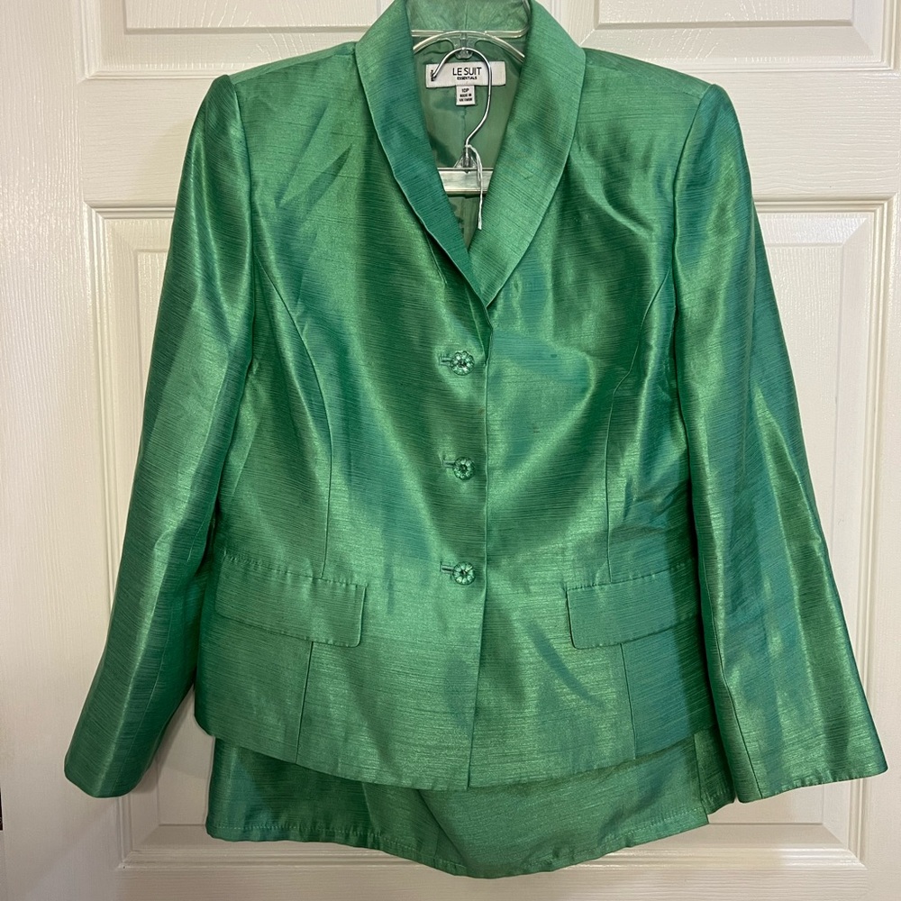 Beautiful green suit with skirt and jacket